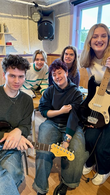 Sam surrounded with his new classmates